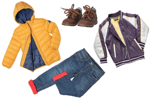 Childrens winter clothes. A collage set of childrens warm jackets, a warm thermojeans and a matching winter shoes isolated on white background. Children autumn and winter fashion.