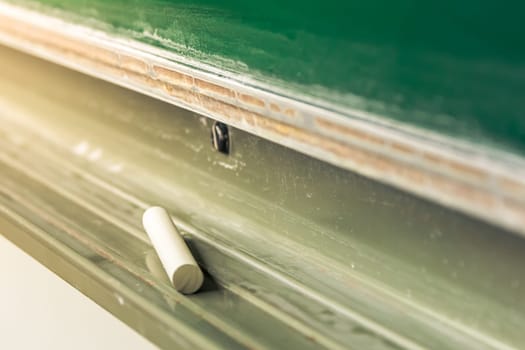 Chalk Lying Alone in Tray Below Green Board Education Writing Tool Symbolic College University