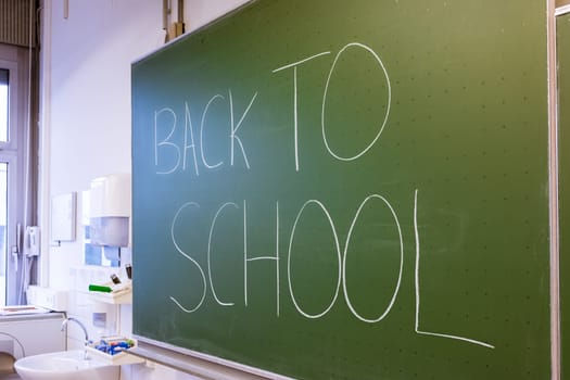Teacher Writing on Green Chalkboard Professor University White Chalk College Education Lesson Back to School
