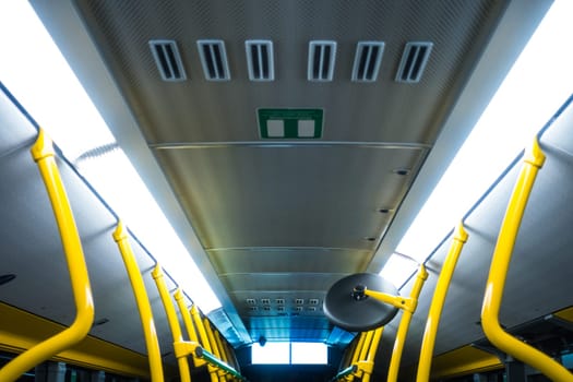 Public Transportation Bus Interior Yellow Poles White Fluorescent