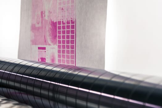 Flexography Backlit Proofing Web Roller Preview Test Calibration Closeup Press Machine Industrial Running Magenta Quality Sheet Material