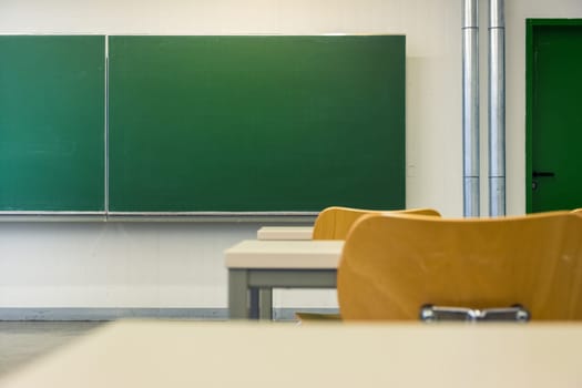 Empty Wooden Chairs at Tables Depth of Field Lecture Hall Nobody Green Chalkboard University Education College Higher Single Seat
