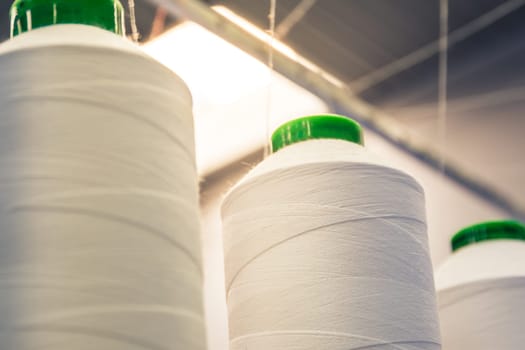 Industrial Fiber Spools Cotton Thread Factory Flare Closeup