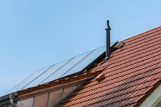 German House Orange Ceramic Tiles Solar Water Heater Blue Sky Sustainable Residential