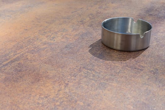 Metal Aluminium Ash Tray on Copper Table Top Texture Background Smoking Clean New Bright