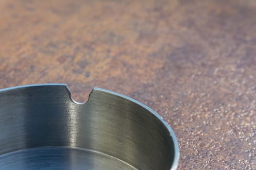 Metal Aluminium Ash Tray on Copper Table Top Texture Background Smoking Clean New Bright