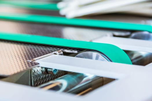 Paper Folding Machine Conveyor Belt Rubber Thin Lines Green Wheels Steel Moving Machinery Industrial Production
