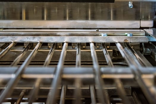 Paper Folding Machine Fold Unit Inside Metal Bars Press Closeup Inner Workings Print Production Book Signature Slot