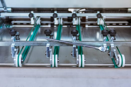Paper Folding Machine Transfer Wheels Rollers Print Production Letter Sheet Moving Screws Adjustments Closeup