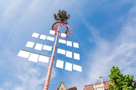 Blank White Signs on Traditional German May Pole Maibaum Blue Skies Local Tradition