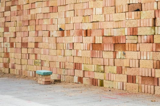 Piles of Bricks in the Construction Site