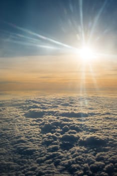 A Close-up of Clouds and Sun Photo Taken on the Airplane
