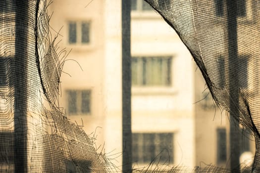 Broken Window Screens of a Chinese Apartment