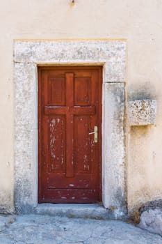 Old Ancient Ruined Worn Eroded Red Door on Side of Cathedral Beautiful Medieval Vintage Architectural Feature
