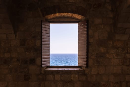 Old Vintage Window Open Shutters Looking Out at Ocean Castle Fortress Interior Perspective
