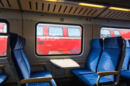 Modern Train Wagon Interior Seats Rows Blue Transportation White Daytime Traveling Empty