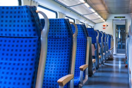 Modern Train Wagon Interior Seats Rows Blue Transportation White Daytime Traveling Empty