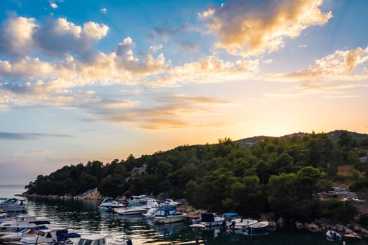 Beautiful Sunset Clouds over Mountains and Ocean in Croatia with Fiery Colors on Landscape