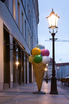 Plastic Ice Cream Cone Outside Cafe Under Street Lamp Afternoon Sidewalk Huge Large Massive Dessert Statue Figure