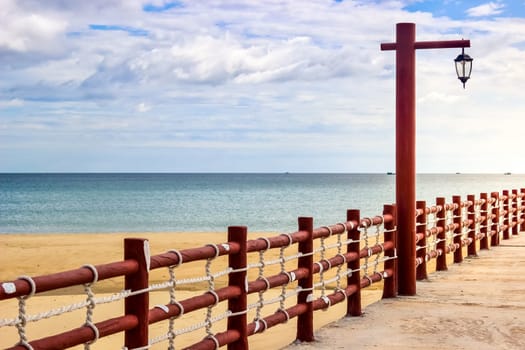 Red Wooden Beach Dock Ropes Lamps Ocean Empty