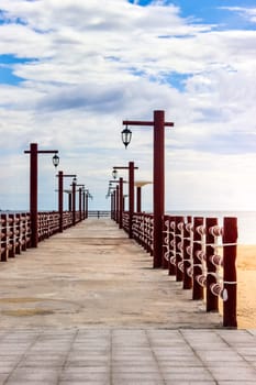 Red Wooden Beach Dock Ropes Lamps Ocean Empty