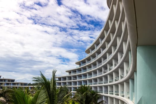 Tropical Hotel Curving Exterior Sunny Beach Vacation Palm Trees