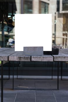 Blank Restaurant Menu Card in Holder Wooden Table Closeup Template White Space