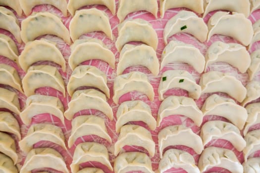 Chinese Dumplings Jaozi on Baking Paper Preparation
