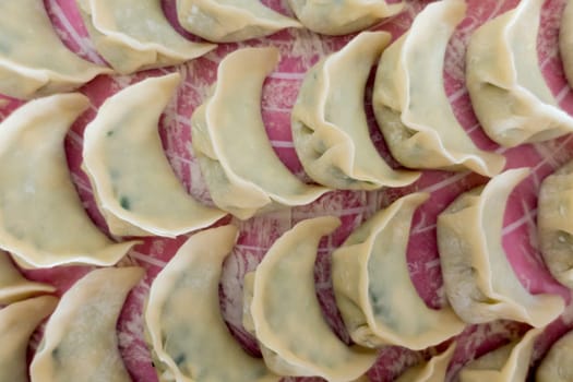 Chinese Dumplings Jaozi on Baking Paper Preparation