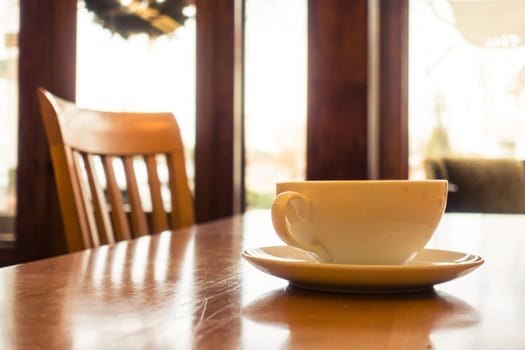 Coffee Cup in Bright Warm Sunny Cafe