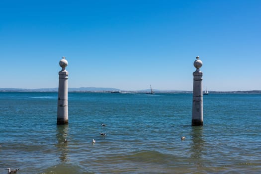 View of Ocean from Shore of Comercio Square in Lisbon Portugal Landscape Daytime View