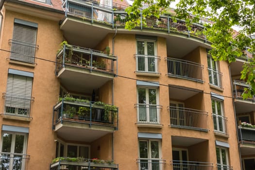 Vintage European Apartment Building Facade Balconies Front View from Street