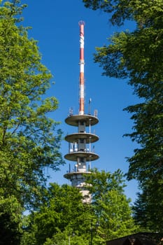 TV Tower on Blue Sky Green Trees Sunny Summer Wireless Communication Technology Engineering Architecture