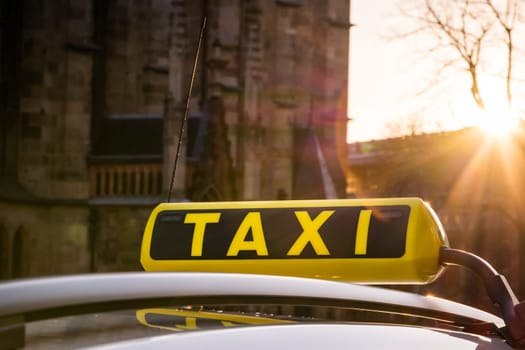 Taxi Symbol Sign Call Sunset Flare Outdoors European Travel Tourism Car Roof Yellow Black