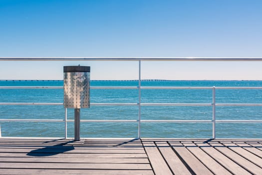 Sunny Day Beach Dock Trash Can Railing Blue Sky Wood Landscape View