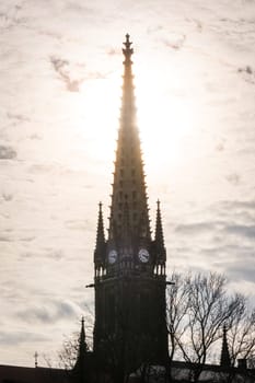Sunset Behind Clock Tower Spire Silhouette Architecture Point Clouds Bright Flare