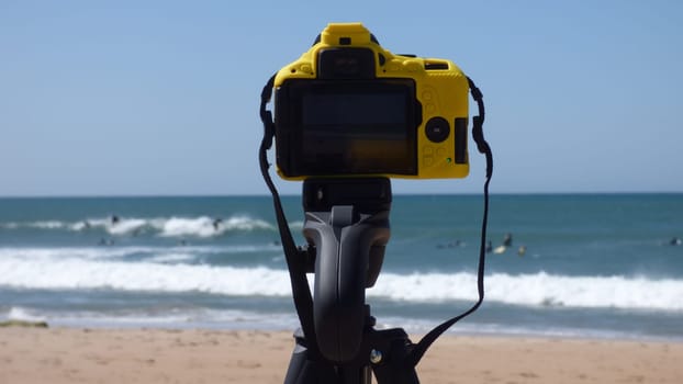 Camera Setup on Tripod Taking Pictures of Beach