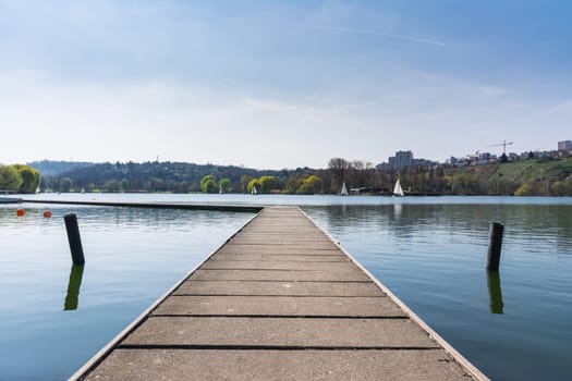 Concrete Dock Perspective Out onto Lake Outdoors Autumn Daytime Landscape