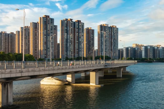 Daytime Upscale Apartments on River and Boating Area