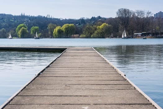 Concrete Dock Perspective Out onto Lake Outdoors Autumn Daytime Landscape