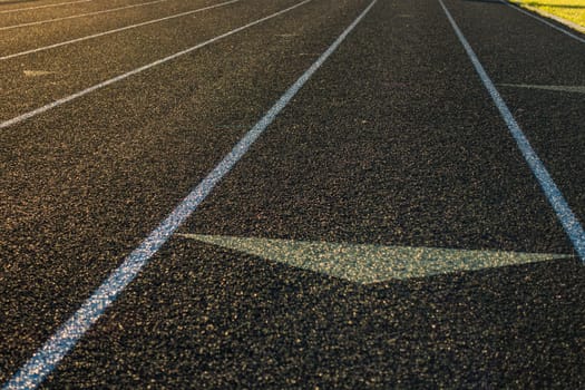 Running Track Sun Flare Arrow Lanes Black Turf Grassy Sports Field