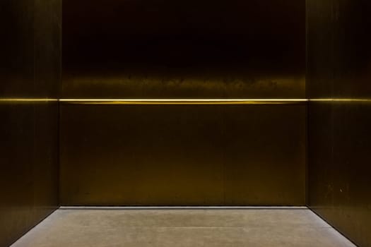 Empty Fancy Elevator Carriage Metal Pole Inside Metal Box Interior Closed Elegant Gold Bronze Overhead Floor Trap Blank Room