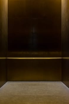 Empty Fancy Elevator Carriage Metal Pole Inside Metal Box Interior Closed Elegant Gold Bronze Overhead Floor Trap Blank Room