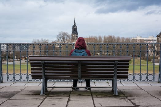 Girl Sitting Alone on Bench Cold Winter City Landscape Dresden Wooden Young