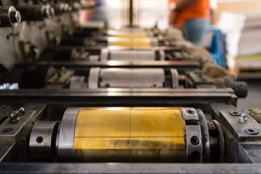 Golden Letterpress Cylinders Rustic Vintage Printing Method Metallic Rollers Four Color CMYK Print Closeup Machine Industrial Equipment