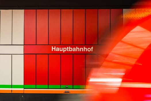 Hauptbahnhof German Train Station Sign Red Motion Blur Wagon Passing Moving Symbol Text