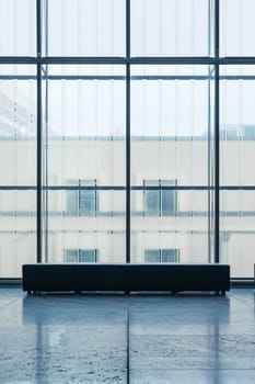 Indoor Rectangular Bench In front of Glass Wall Cold Blue Atmosphere Art Gallery Quiet Room Alone