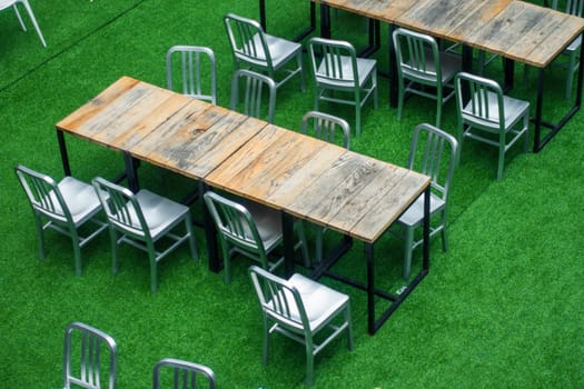 Desks and Chairs are arranged in order on the Lawn