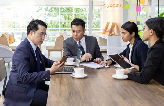Business team have a meeting in a cafe