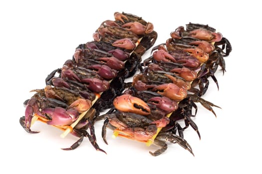 close up of skewered crabs, traditional food in asia